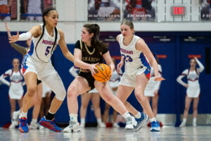 Mohigans flex defensive muscles early against John Marshall to open postseason play